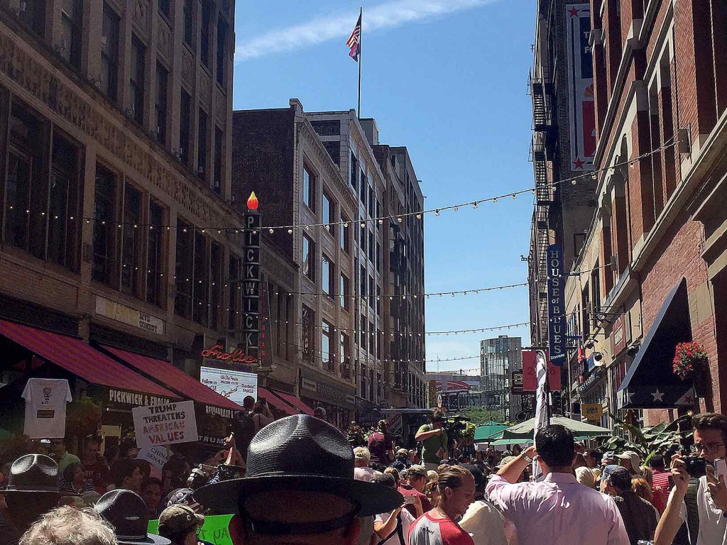 A trooper watches the crowd on East 4th Street.